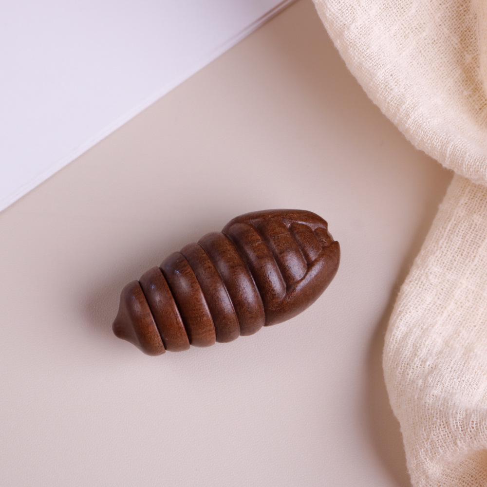 

Sandalwood Carved Silkworm Pupa Handheld Ornament