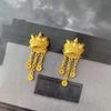 Dames Leeuwendans Kwast Oorbellen | Openwerk leeuwenpatroon, micro-diamant glans met magnetische sluiting