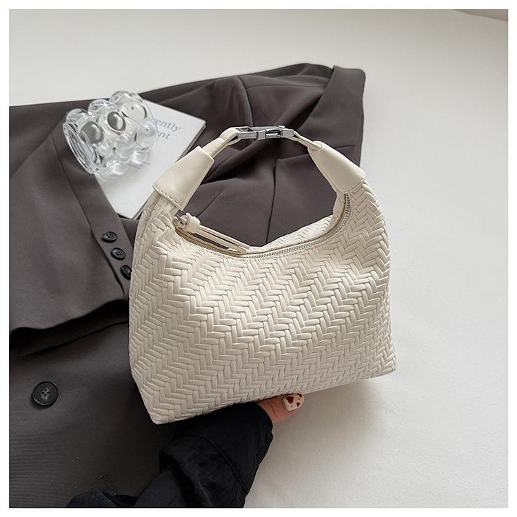 French Niche Woven Pattern Handbag Women's 2025 Spring and Summer Simple and Elegant Dumpling Bag Commuter Texture Messenger Bag