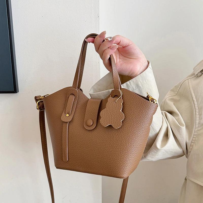 

Litchi Standard Hand-Held Wing Bag Простая фактурная сумка Гламурная сумка-ведро через плечо