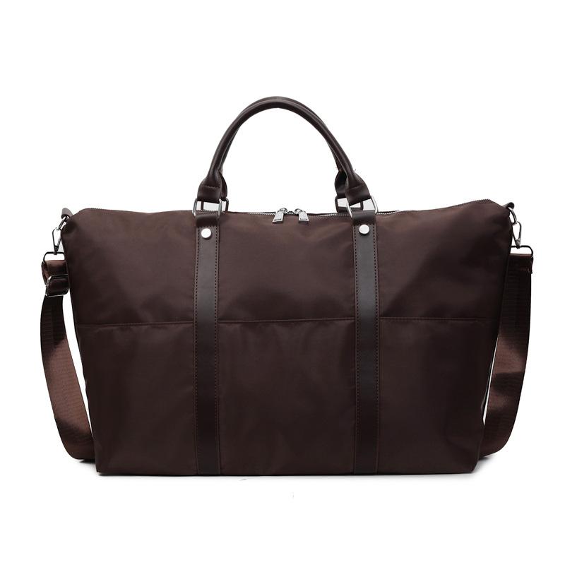 

New portable short-haul travel bag, business trip, large-capacity luggage storage bag, leisure sports, unisex fitness bag темно-коричневого кольору