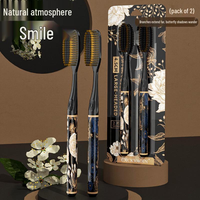 

Элегантная черно-золотая зубная щетка с мягкой щетиной, густыми ворсинками и длинной широкой головкой