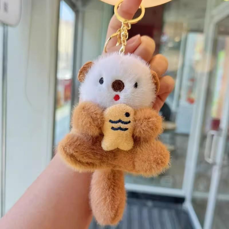 2pcs Fashion Lovely Plush Otters Holding Fish Key Chains Cartoon Cute Otters School Bag Pendant Keyring Funny Toy Student Gifts