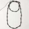 Elegant Retro Pearl Necklace: Women's High-End Light Luxury Sweater Chain.