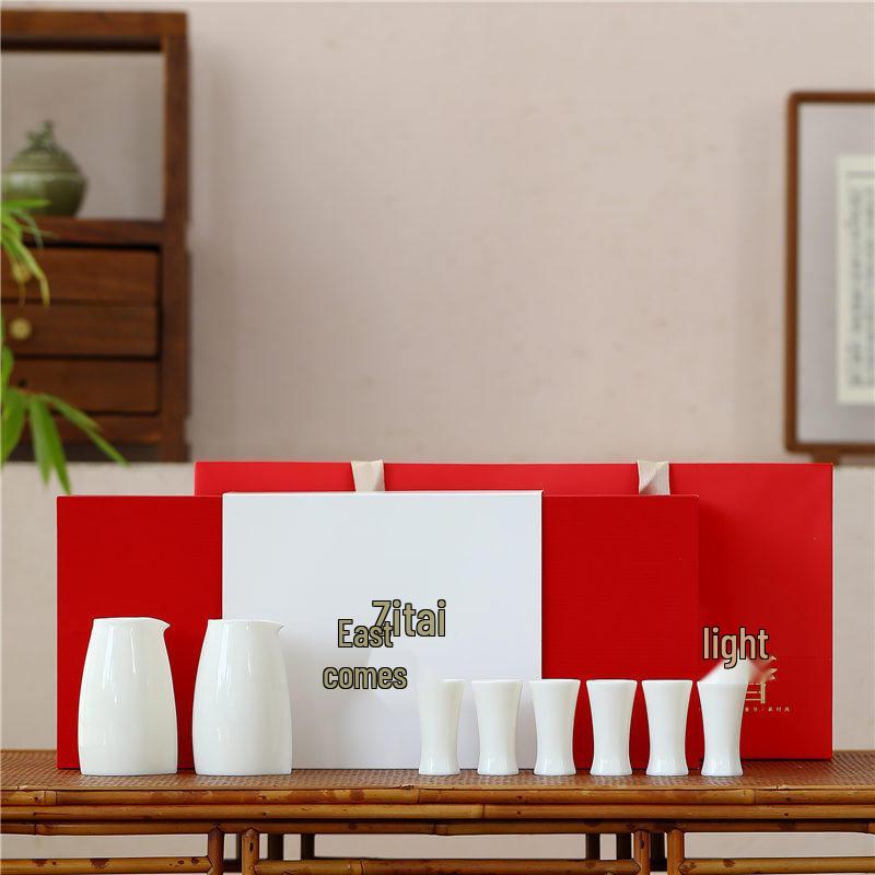 

Antique-Style Sheep Fat Jade Porcelain Wine Set: Baijiu Cups, Decanter, Sake Pot, and Small Ceramic Wine Cups.