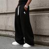 Loose-fitting men's straight-leg sweatpants with a drawstring waist feature convenient pockets, perfect for both home and on-the-go