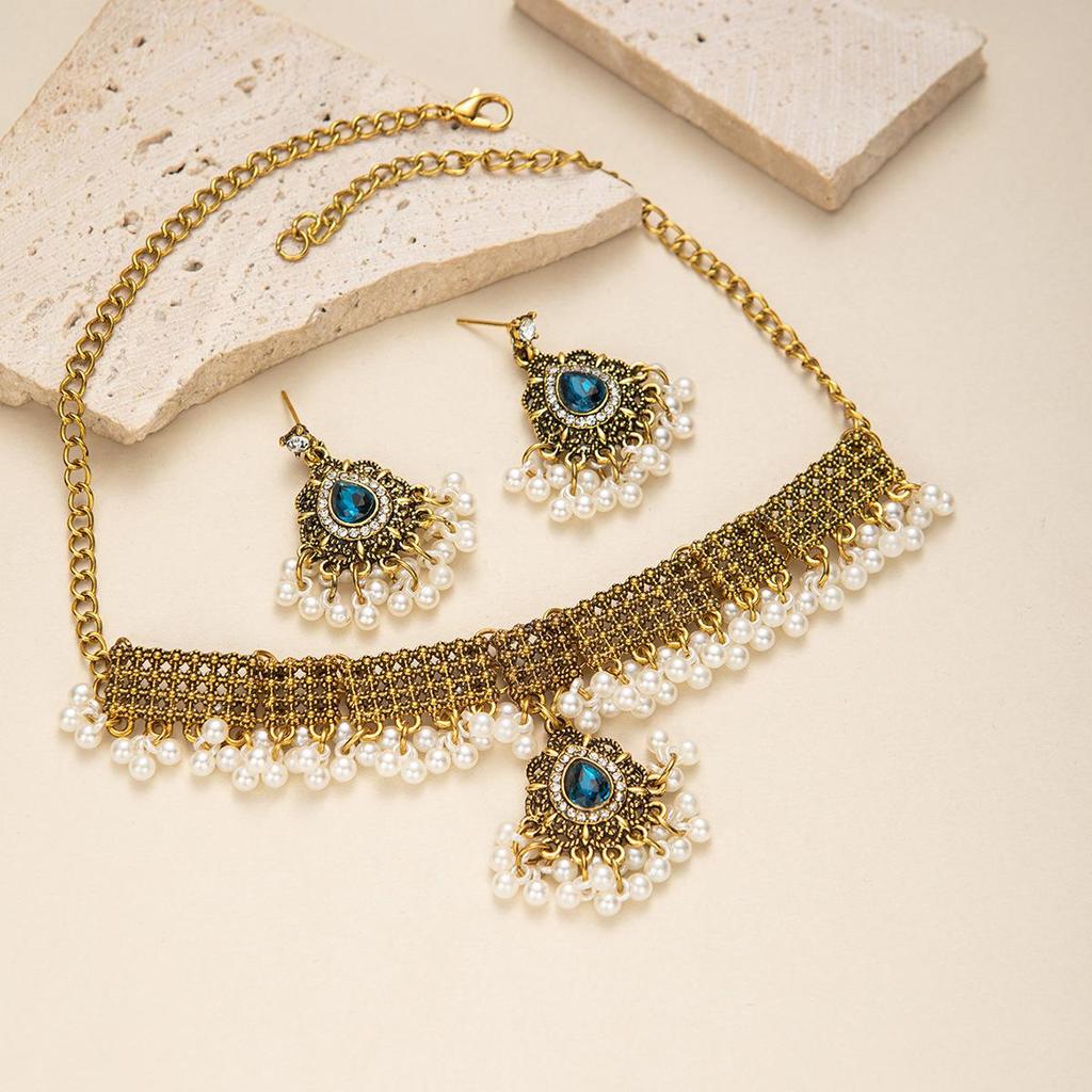 European & American Exotic Style Jewelry Set: Bohemian Clavicle Necklace with Pearls and Tassel Earrings Inlaid with Zircon Diamonds.