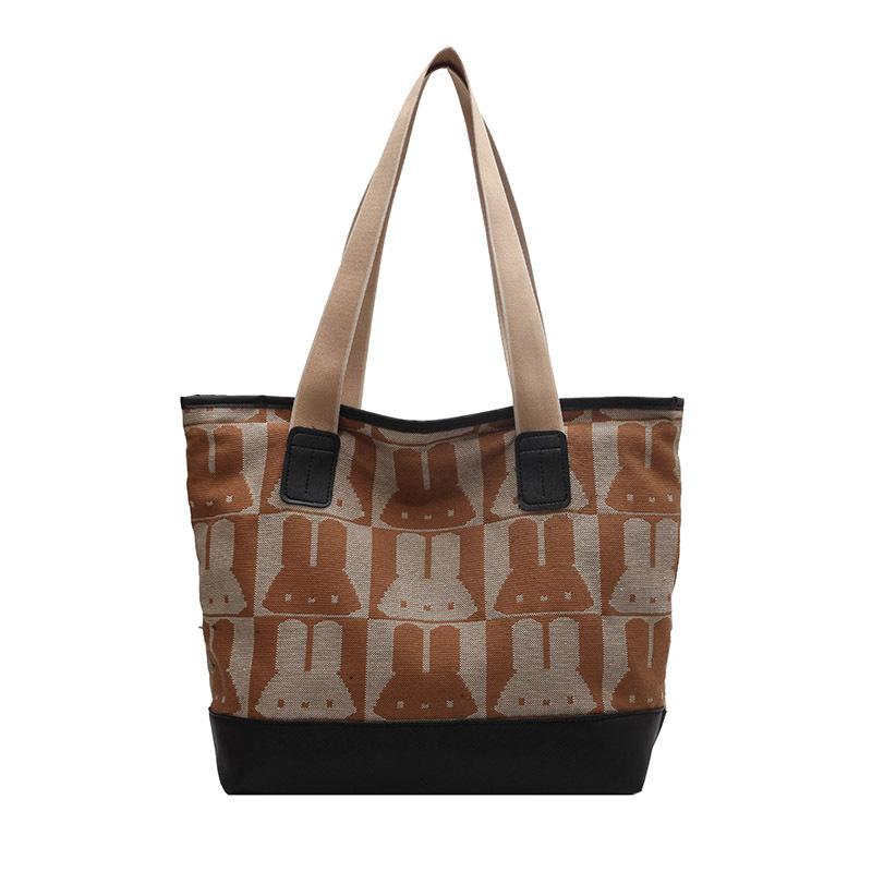 

Large capacity canvas bag women s new trend simple college student make-up bag fashion printed messenger tote bag хакі