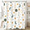 Space-themed shower curtain with celestial pattern featuring suns, moons, stars, and planets in green, blue, and orange colors