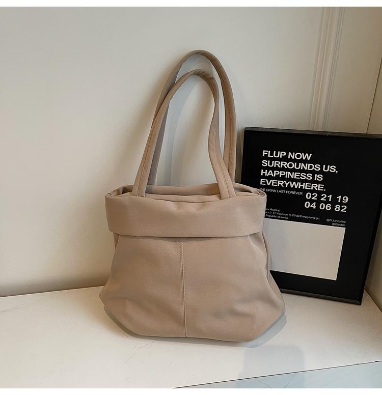 

Niche design simple and versatile bucket bag women 2025 new fashion casual cloth bag commuter messenger bag хаки