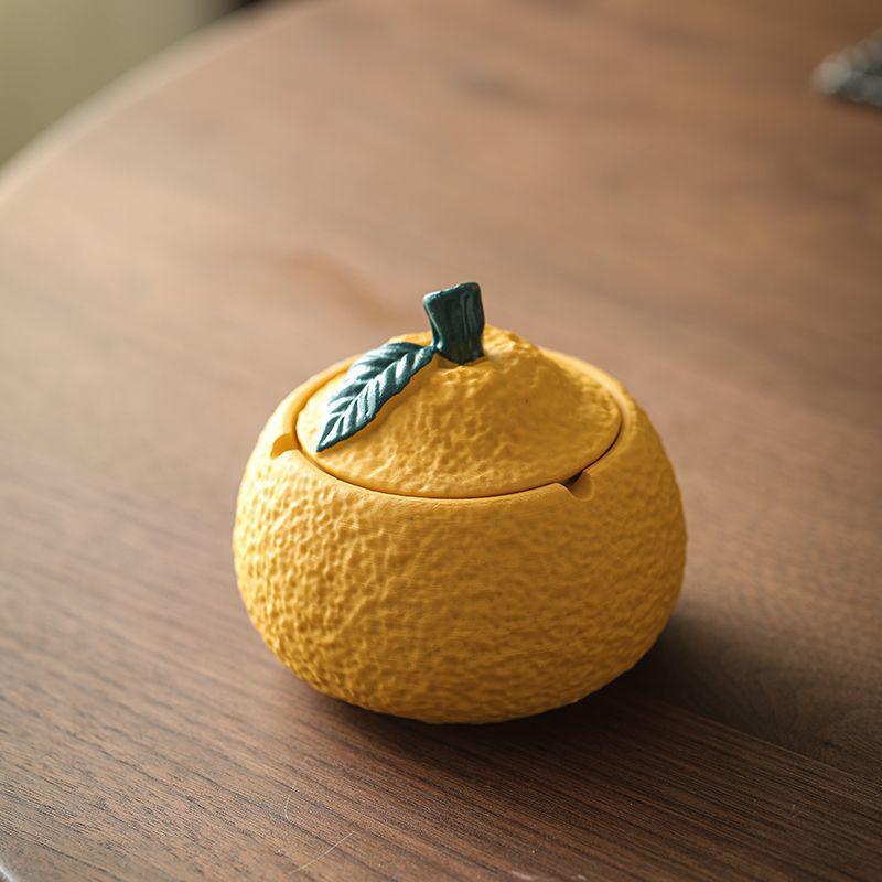 Resin Orange Ashtray with Lid - Creative, Anti-Fly, Stylish Living Room or Office Decor.