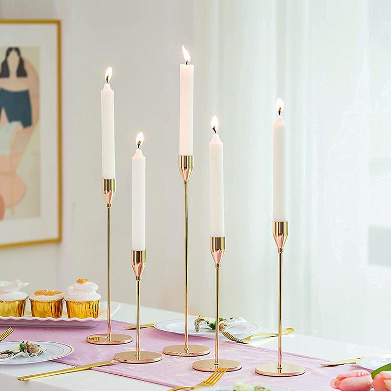 Elegant European Candle Holder Set: Electroplated Three-Piece Metal Ornament for High-End Dining and Wedding Décor.