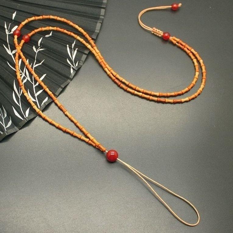 

Olive Pit & Bamboo Necklace Pendant with Jade Amber Lanyard Cord No Specification