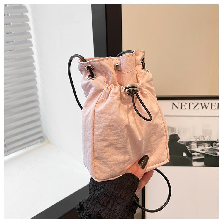 Minimalist style Japan and South Korea light drawstring canvas trend 2025 personalized solid color shoulder crossbody change mobile phone bag women's