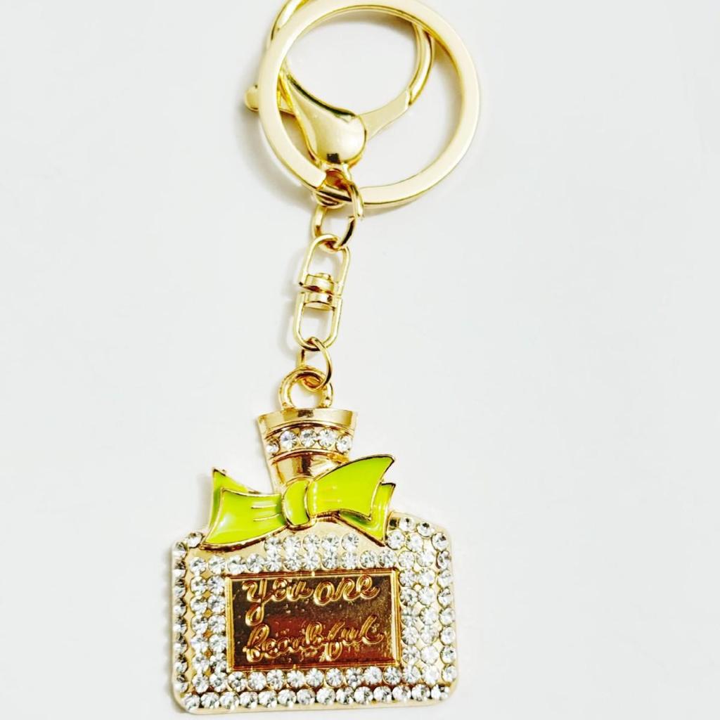 Radiant Bow Perfume Bottle Keychain & Elegant Bag Pendant Gift