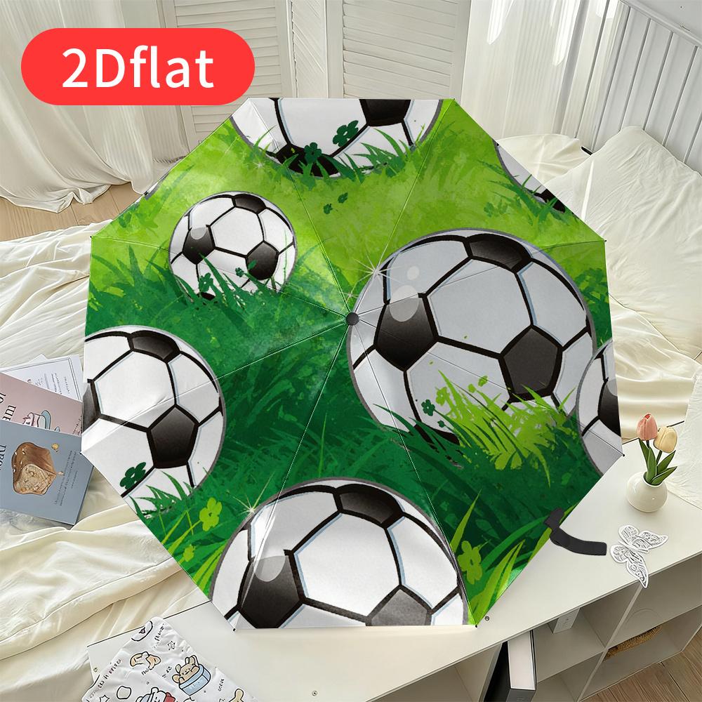 A Football-themed Folding Umbrella - Featuring a Vibrant Green Grass Design with Multiple Black and White Soccer Ball Patterns