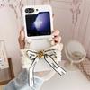 Applicable Samsung ZFlip7 mink plush phone case zflip6 bow camellia lanyard portable protective case