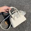 Lace Bow Boston Bag, A Textured and Fashionable Crossbody Bag, A Commuter Shell Bag