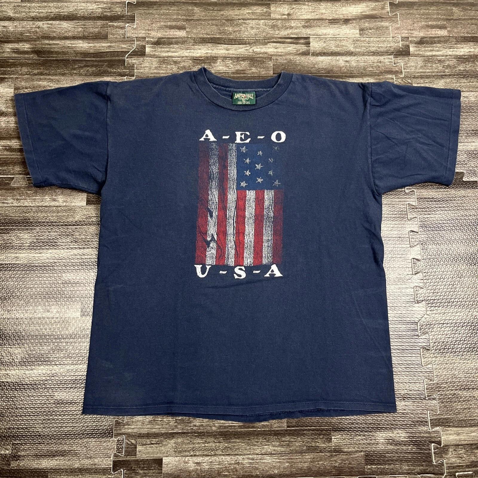 

Vintage 90s American Eagle Outfitters AEO Flag Tshirt Blue XL Single Stitch USA S