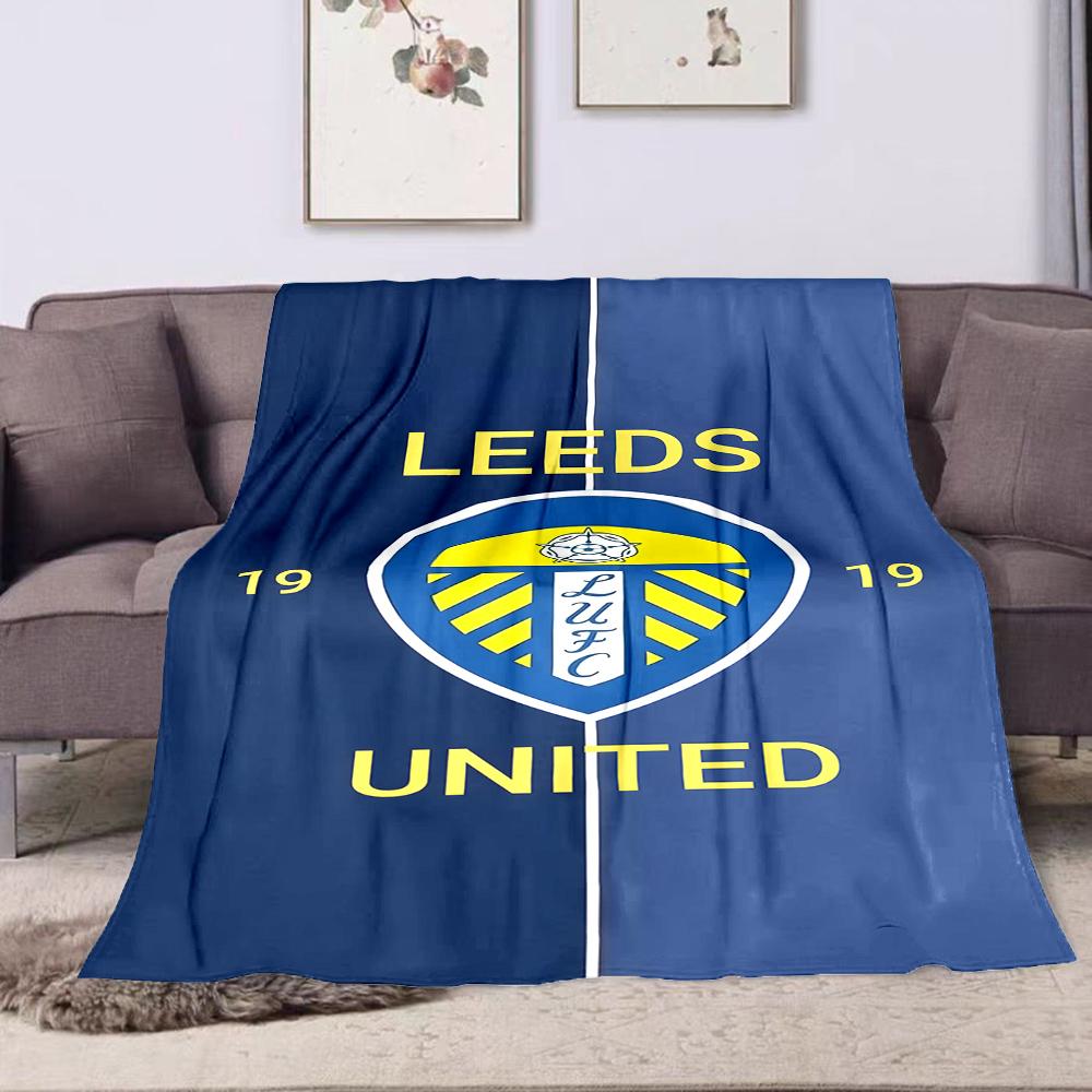 Leeds United Blue and Yellow Logo Blanket Patterned flannel blanket perfect for the bedroom living room, sofa, or a little nap