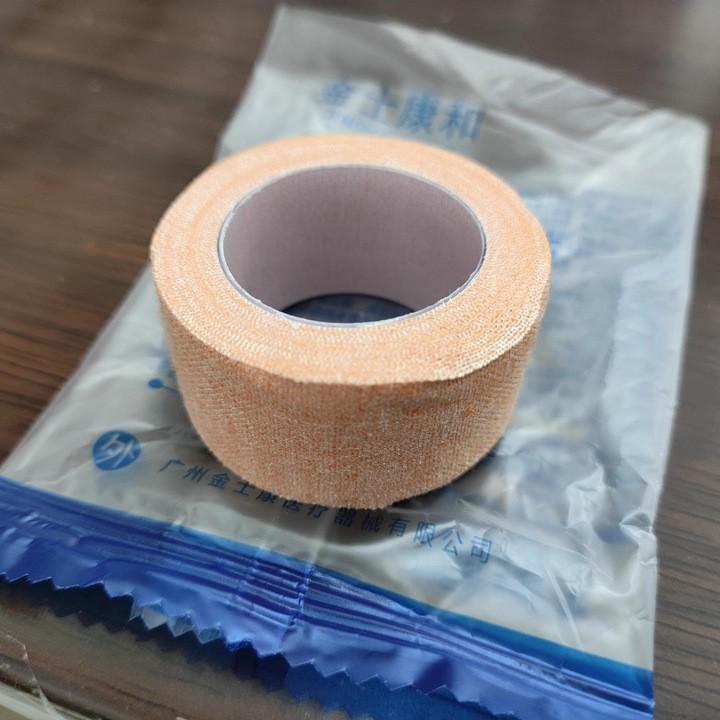 Jinshikang Medical Tape Roll: Strong, Skin-Adherent, Pressure-Sensitive Cotton Cloth Tape for Hand Protection and Tension Reduction.