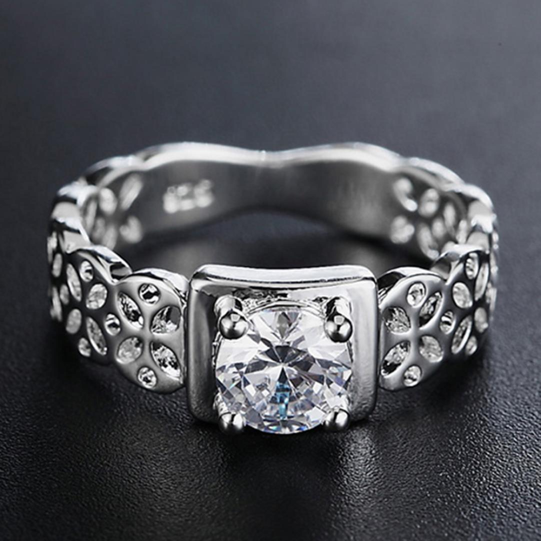 

Женское посеребренное свадебное кольцо со стразами