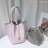 Spot wholesale top layer cowhide vegetable basket bag leather bucket bag commuter fashion lock buckle hand-held handbag woman