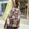 Schultasche Herbst und Winter neuer karierter Rucksack weiblich Koreanischer fauler Stil Pendlerrucksack Grund- und Sekundarschüler Rucksack mit großer Kapazität