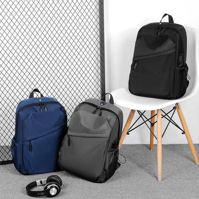 Men's backpack, large-capacity student schoolbag, business trip backpack, college student casual computer backpack.