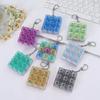 Popular 4-Key Russian Strip Decompression Toy Bag Pendant Keychain