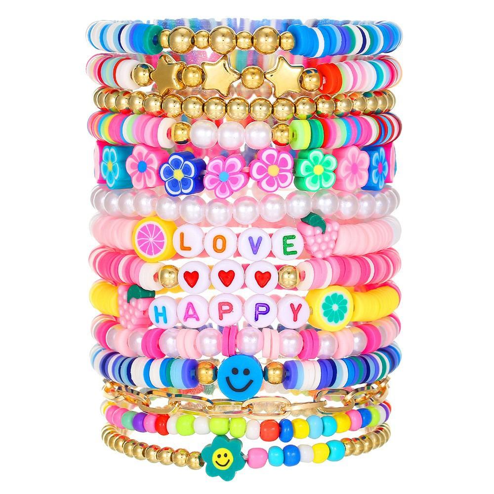 Korean version of fashion new multi-layer elastic thread soft pottery love smiley face bracelet set retro handmade pearl jewelry women