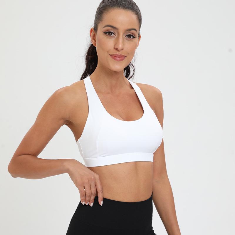 

2024 Дышащий спортивный бюстгальтер: Ударопрочный, влагоотводящий жилет с нагрудной вставкой для йоги, бега и фитнеса. S белый