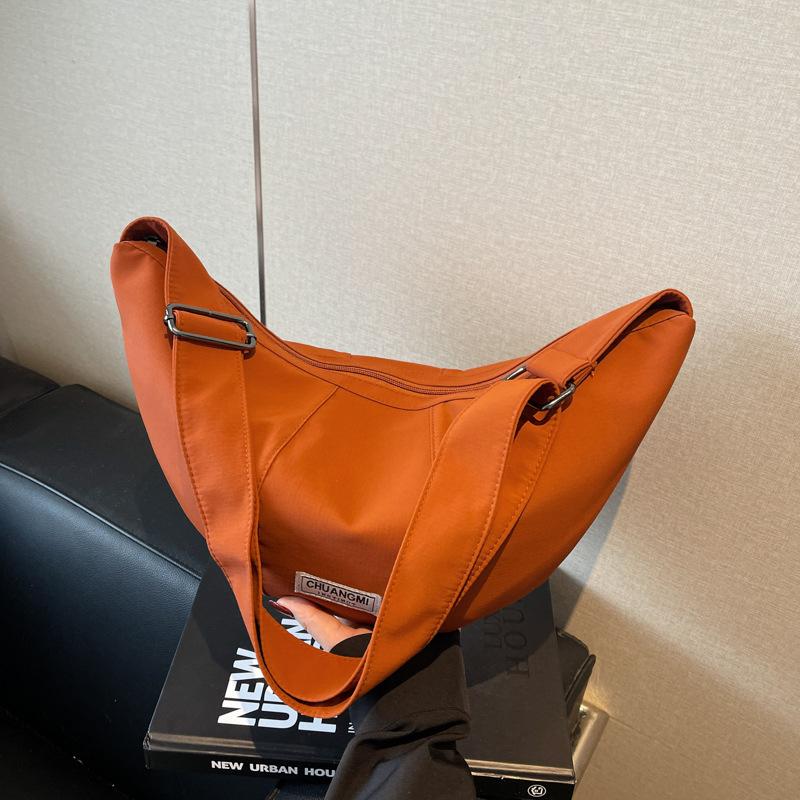 

Large capacity bag women s new casual niche design shoulder messenger bag fashionable commuter dumpling bag оранжевый