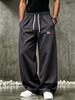 Pantaloni della tuta casual da uomo, pantaloni a gamba larga con coulisse in vita e tasche laterali per il tempo libero all'aperto e l'abbigliamento quotidiano