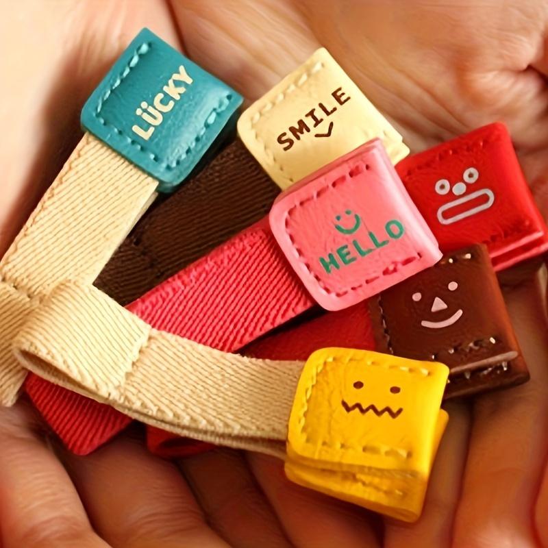 

Durable 6pcs PU Leather Earbud Cord Organizers - Space-Saving Design for Tidy Earphone Management with Fun Joyful Expressions