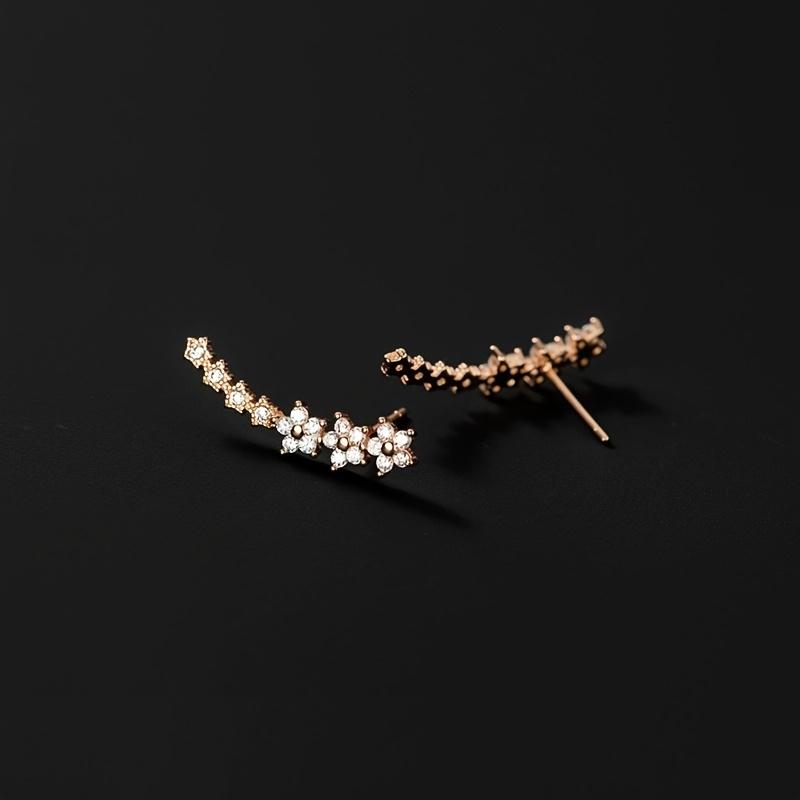A pair of elegant and luxurious delicate floral stud earrings, fully set with diamonds and rhinestones, perfect as a Thanksgiving gift for women