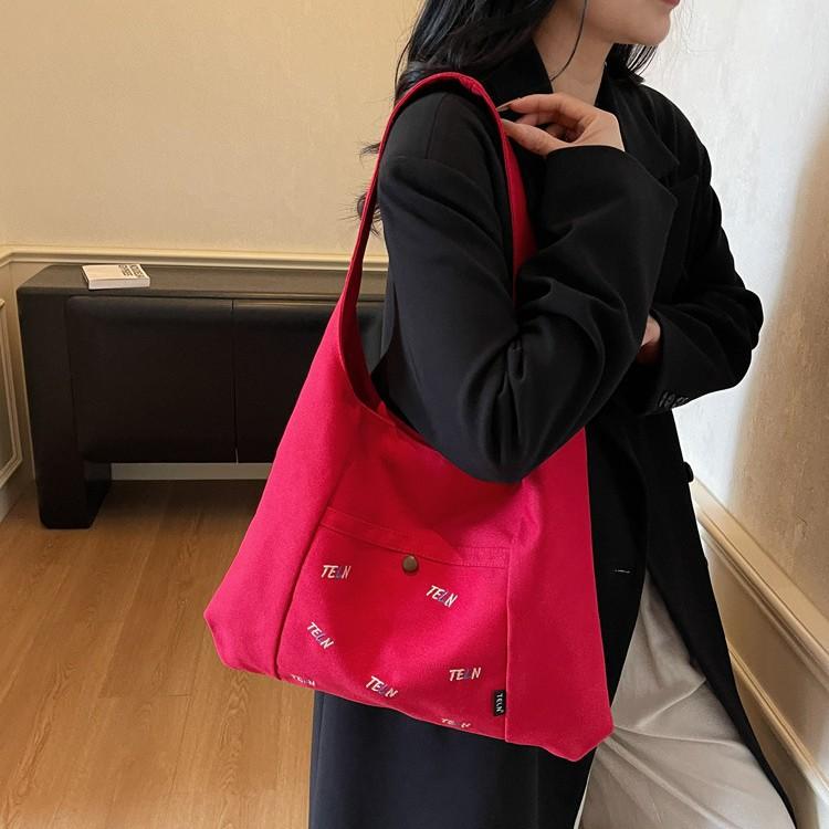 Canvas bag Women's shoulder bag Large capacity commuter tote bag Versatile student armpit bag