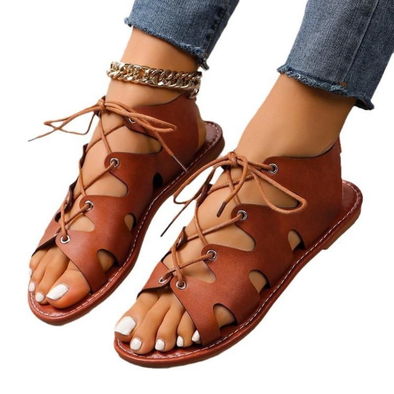 Flat open-toed crossed thin strap cool slippers women's new fringed shoes hollow women's sandals