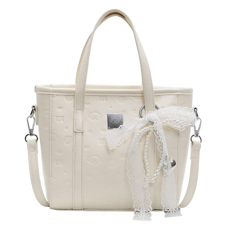 Spring and summer popular niche sweet and cute embossed portable bucket bag Korean version commuter casual versatile messenger bag bag woman