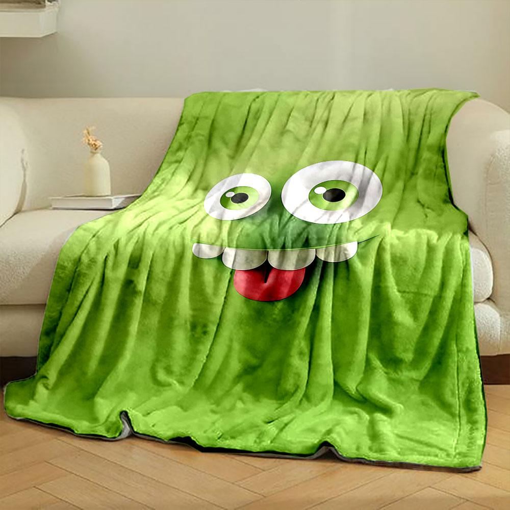 A Playful Green Cartoon Face with Big Eyes, Teeth, and a Sticking-out Tongue. for All Seasons Blanket Lunch Break Throw Gift