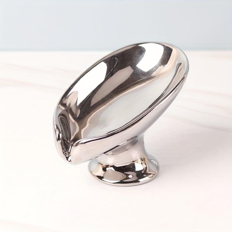 

Элегантная керамическая мыльница в виде золотого и серебряного листа, овальный самодренажный дизайн для организации ванной комнаты, подставка для хранения в форме листа с текстурированной поверхностью