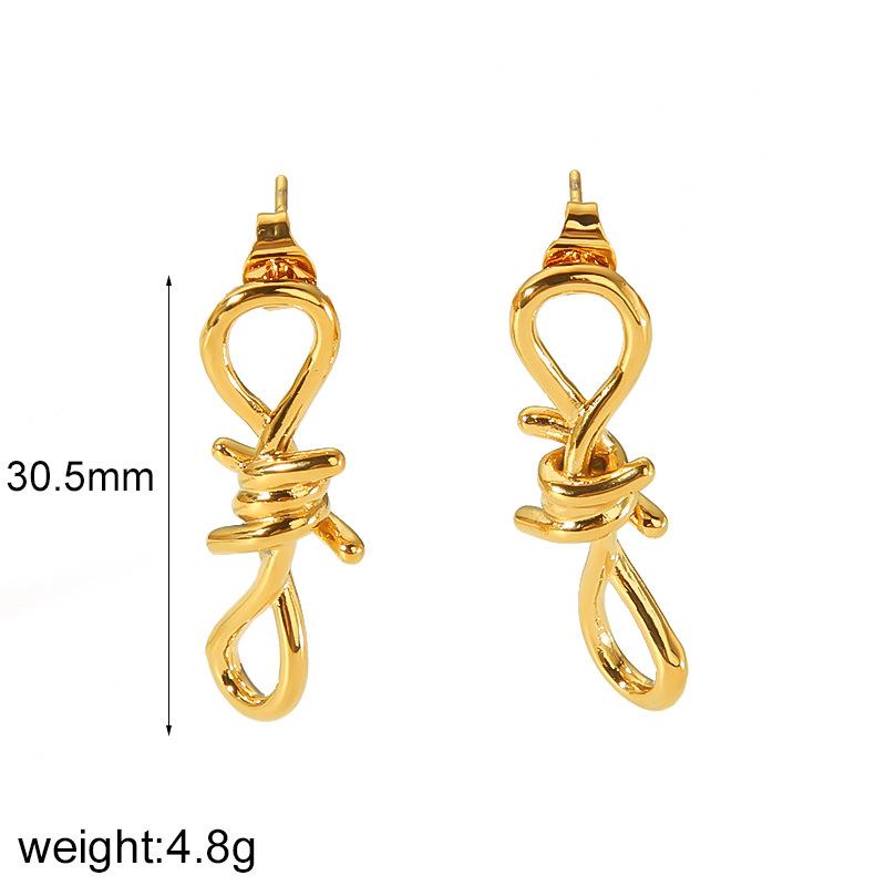 

Exaggerated niche high-end bow pearl earrings, geometric twist line earrings, jewelry 18k gold does not fade