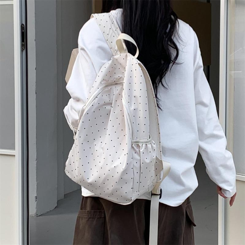 New color-blocked polka dot backpack for women, niche student commuting backpack, versatile large capacity travel backpack for women
