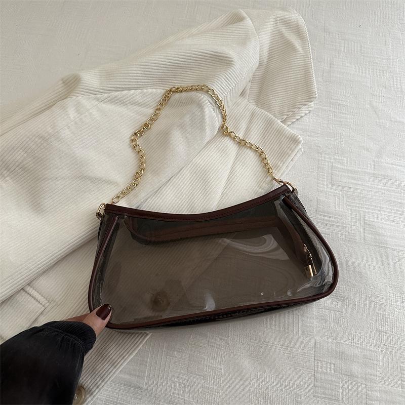 

Маленькая сумка Niche design для женщин 2025 года, новая модная универсальная диагональная сумка-багет с цепочкой под мышками, прозрачная сумка