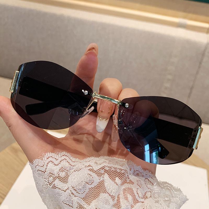 Women's Retro Frameless Oval Curved Lens Sunglasses Metal Sunglasses
