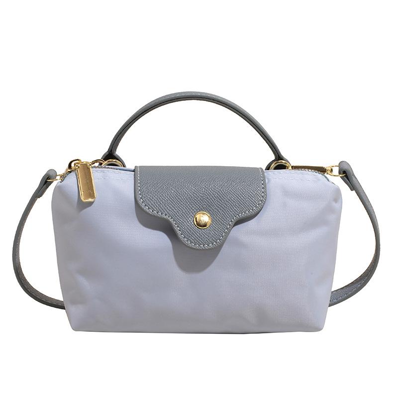Wholesale new products niche simple contrasting color portable small bag women's leisure trendy versatile light splicing messenger change bag