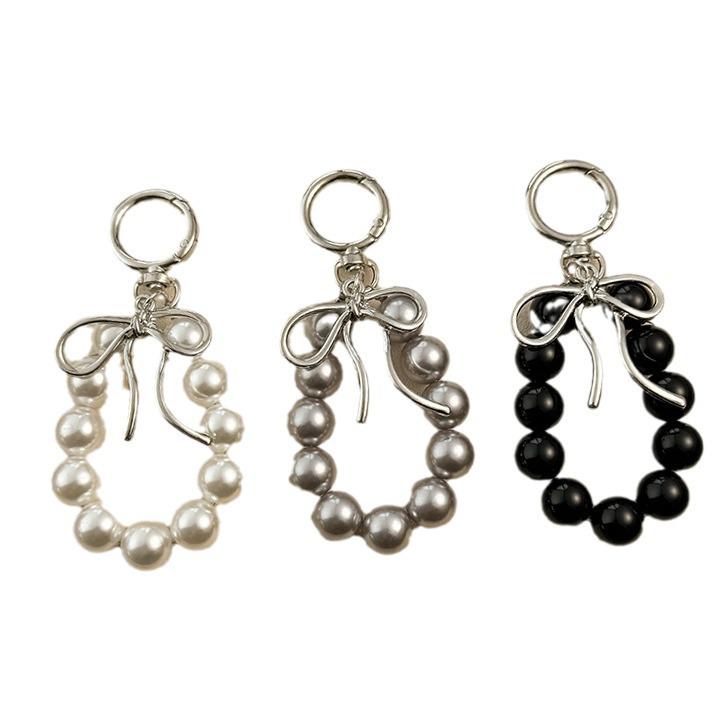 Korean Style Keychain Pendant: Metal Irregular Bow with Pearl Beads for Phone or Bag Accessories