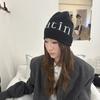 Autumn and winter street letter jacquard knitted hats for men and women to keep warm and wear niche cold hats, pullover hats