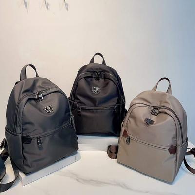 New Women's Waterproof Oxford Cloth Backpack Simple and Casual Solid Color Commuting Bag Versatile and Fashionable Women's Bag