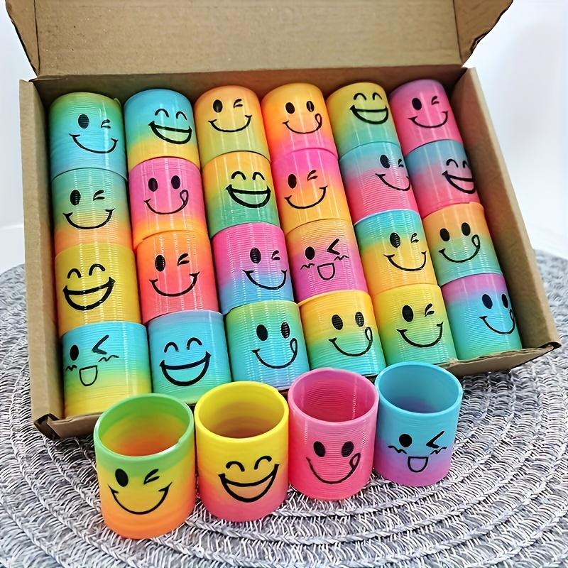 Bunte Plastik-Spiralfeder-Spielzeuge-Happy Face Regenbogen-Designs, für Geburtstags-Partygeschenke, Halloween- und Weihnachtsgeschenke, Karnevalspreise